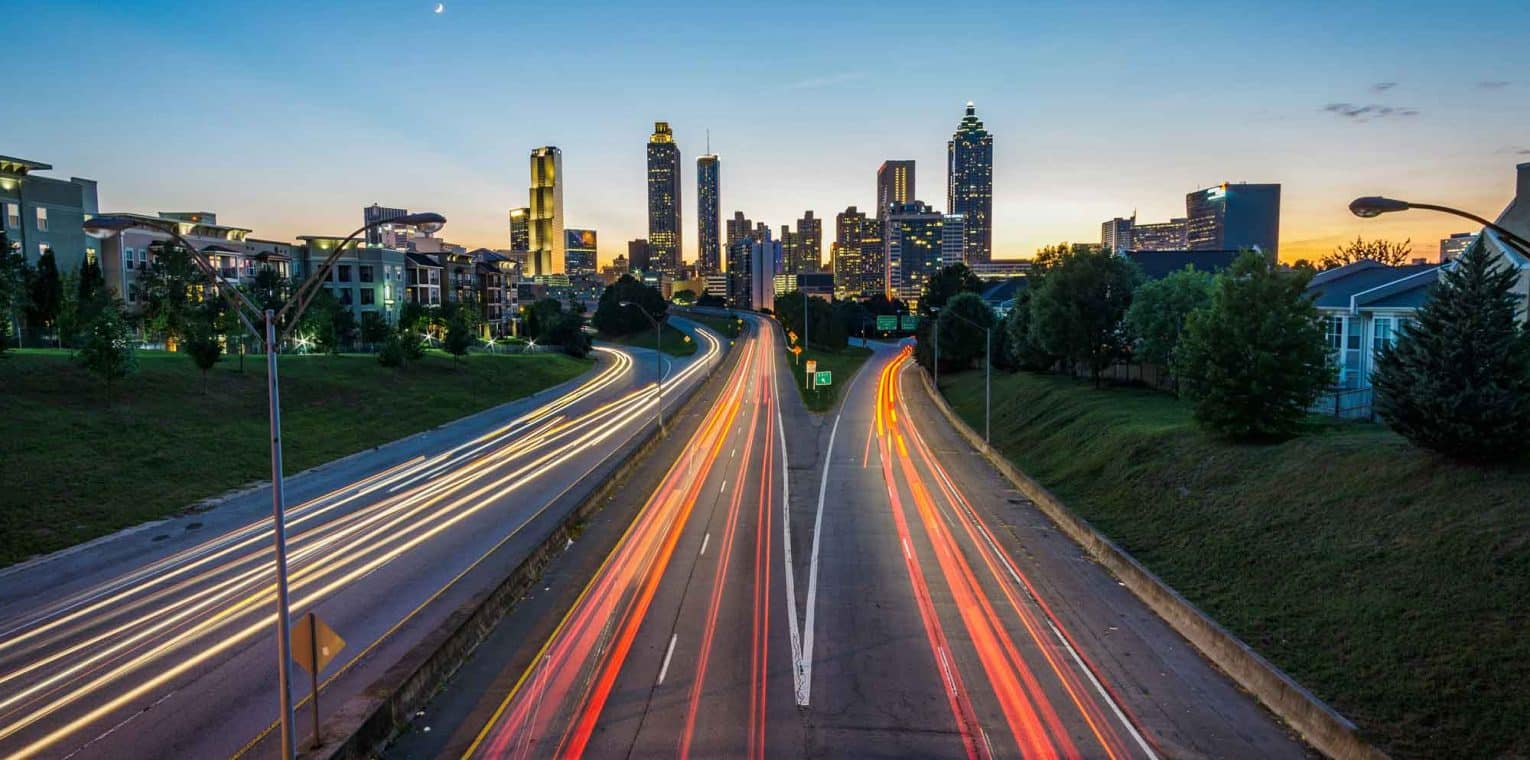Timelapse photo of highway during golden hour. Photo by Joey Kyber on Unsplash