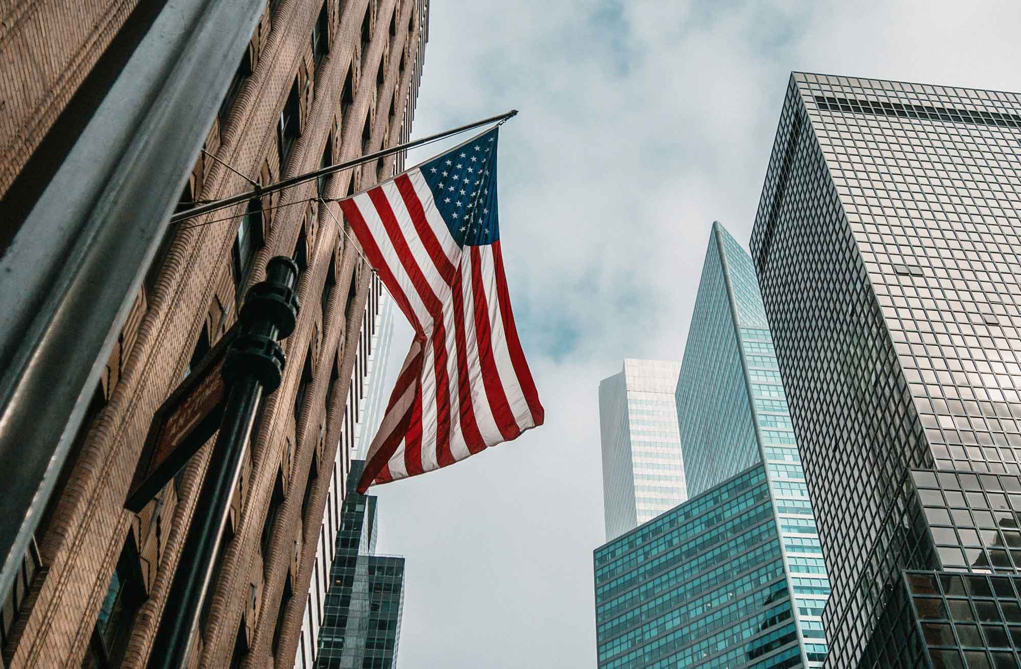 Low angle photo of flag of U.S.A. Photo by Nik Shuliahin 💛💙 on Unsplash